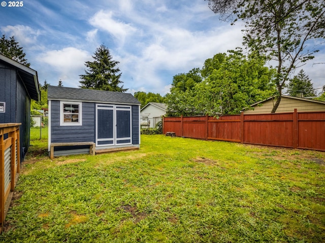 view of yard featuring a shed and an outdoor structure