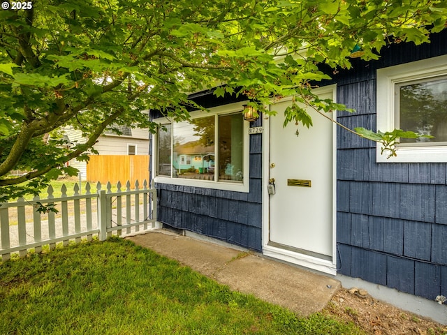 property entrance with fence