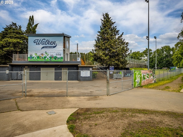 view of community with a gate and fence