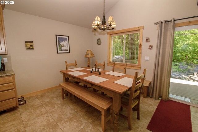 dining area featuring light tile patterned flooring, lofted ceiling, a notable chandelier, and a healthy amount of sunlight