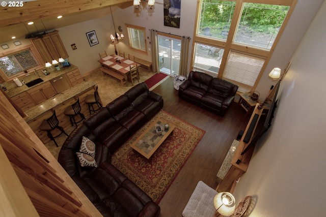 living area featuring recessed lighting, wood finished floors, and a chandelier