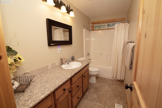 bathroom featuring visible vents, shower / bath combination with curtain, vanity, tile patterned floors, and toilet
