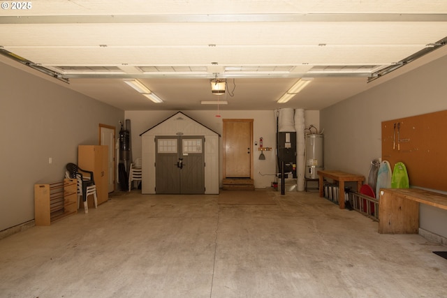 garage featuring heating unit, strapped water heater, and a garage door opener