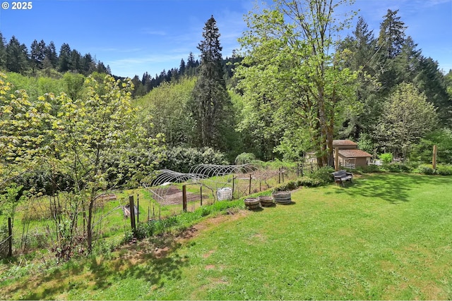 view of yard featuring a view of trees