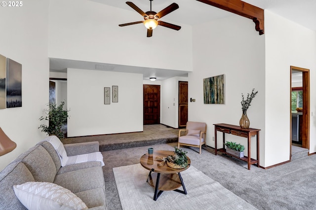 carpeted living room with high vaulted ceiling, a ceiling fan, baseboards, beamed ceiling, and visible vents