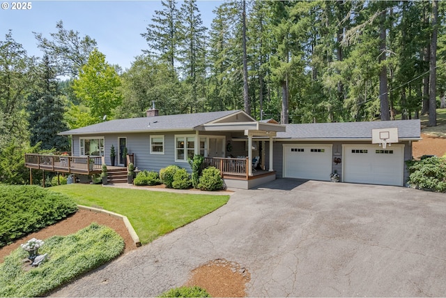 27023 Petzold Rd, Eugene, OR 97402 - ranch-style house with an attached garage, driveway, a porch, a front lawn, and a chimney