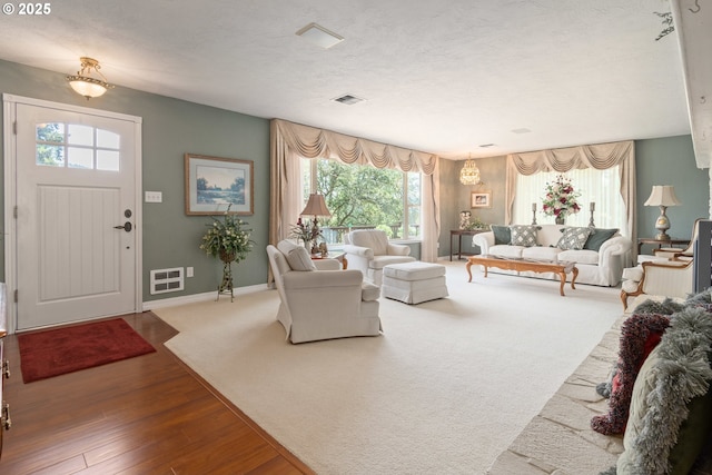 27023 Petzold Rd, Eugene, OR 97402 - living room featuring wood finished floors and a textured ceiling