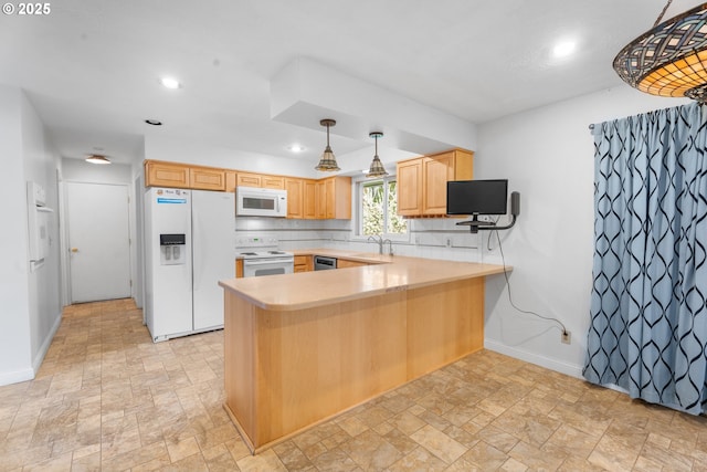 1604 NE 153rd Pl, Portland, OR 97230 - kitchen featuring white appliances, stone finish flooring, light countertops, a peninsula, and recessed lighting