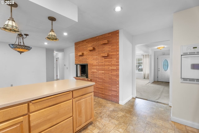 1604 NE 153rd Pl, Portland, OR 97230 - kitchen with oven, recessed lighting, pendant lighting, a fireplace, and light countertops