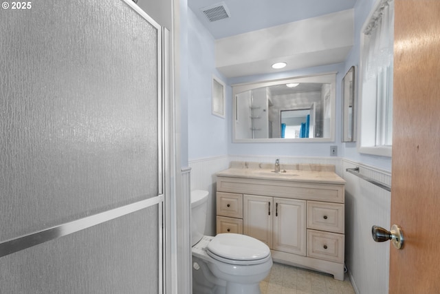1604 NE 153rd Pl, Portland, OR 97230 - bathroom with vanity, a wainscoted wall, and a shower with door