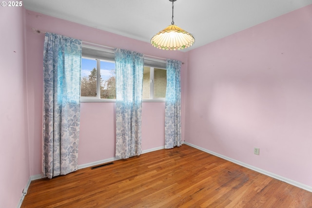 1604 NE 153rd Pl, Portland, OR 97230 - unfurnished room featuring wood finished floors and baseboards