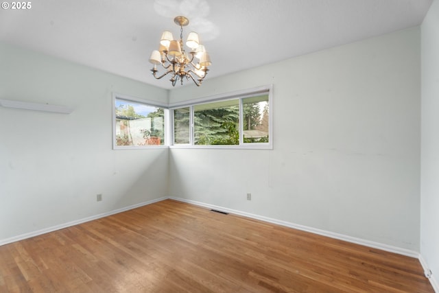 1604 NE 153rd Pl, Portland, OR 97230 - unfurnished room featuring a chandelier and wood finished floors