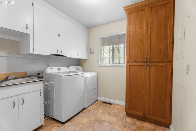 1604 NE 153rd Pl, Portland, OR 97230 - laundry area featuring cabinet space, washing machine and clothes dryer, and light stone finish flooring