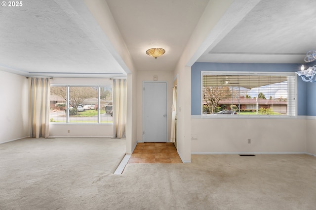 1604 NE 153rd Pl, Portland, OR 97230 - carpeted foyer entrance featuring a chandelier and baseboards