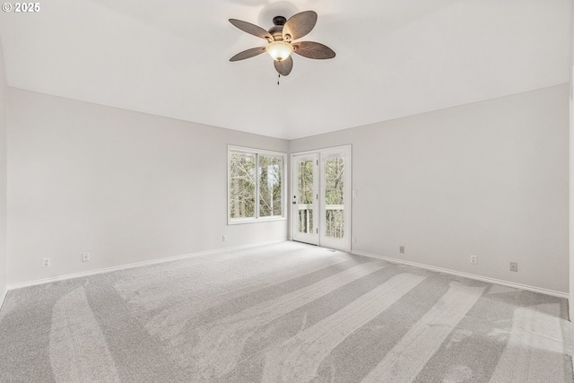 empty room with a ceiling fan, carpet, and baseboards