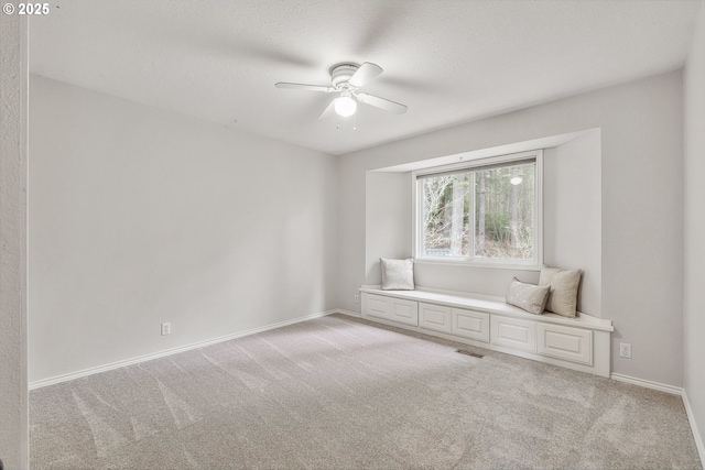 interior space with light carpet, visible vents, and baseboards