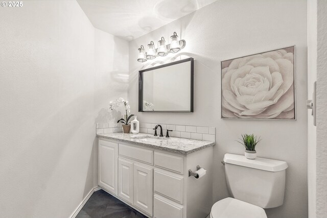10915 SW Mourning Dove Pl, Beaverton, OR 97007 - half bath featuring toilet, baseboards, tasteful backsplash, and vanity