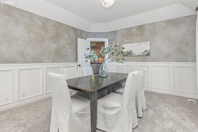 10915 SW Mourning Dove Pl, Beaverton, OR 97007 - dining area featuring wainscoting, visible vents, a decorative wall, and light colored carpet