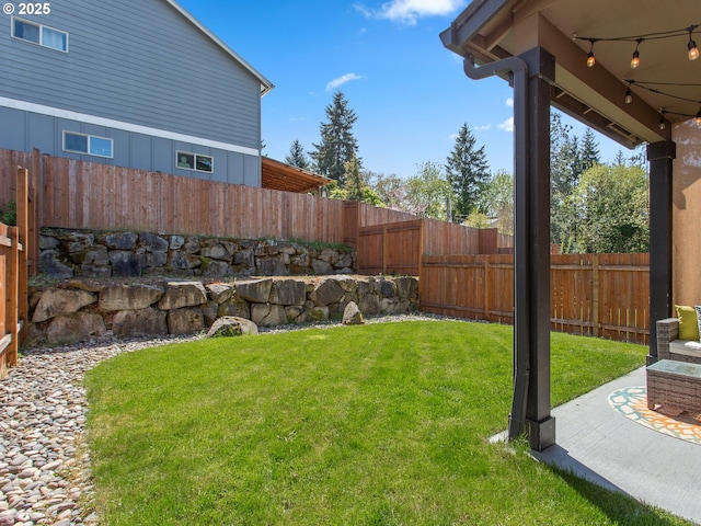 view of yard with a fenced backyard