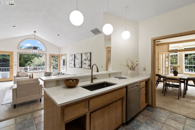 1249 Crenshaw Rd, Eugene, OR 97401 - kitchen featuring a sink, dishwasher, lofted ceiling, stone finish floors, and a peninsula