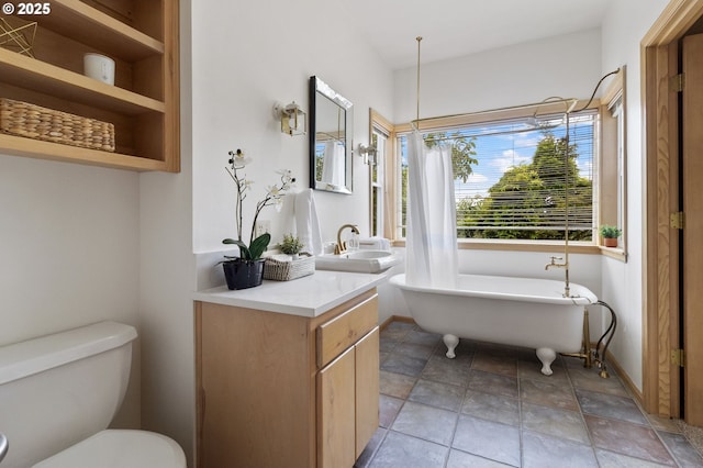 1249 Crenshaw Rd, Eugene, OR 97401 - bathroom with a soaking tub, vanity, toilet, and stone finish floors