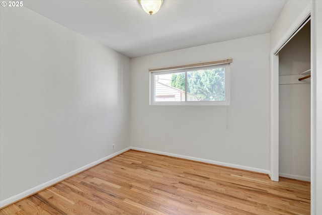 4133 SE Henderson St, Portland, OR 97202 - unfurnished bedroom with baseboards, light wood-style flooring, and a closet