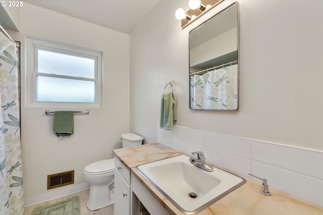 4133 SE Henderson St, Portland, OR 97202 - bathroom featuring vanity, toilet, and visible vents