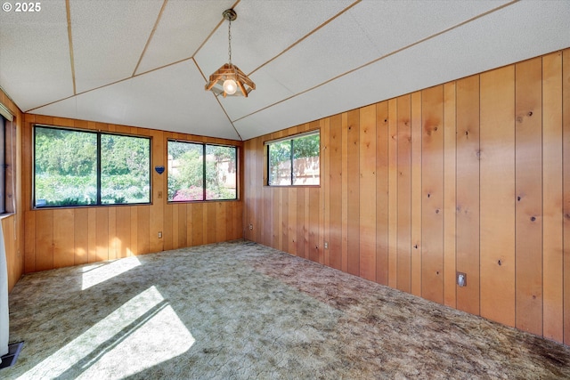 4133 SE Henderson St, Portland, OR 97202 - carpeted empty room with wood walls and lofted ceiling