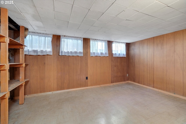 4133 SE Henderson St, Portland, OR 97202 - below grade area featuring wooden walls and tile patterned floors