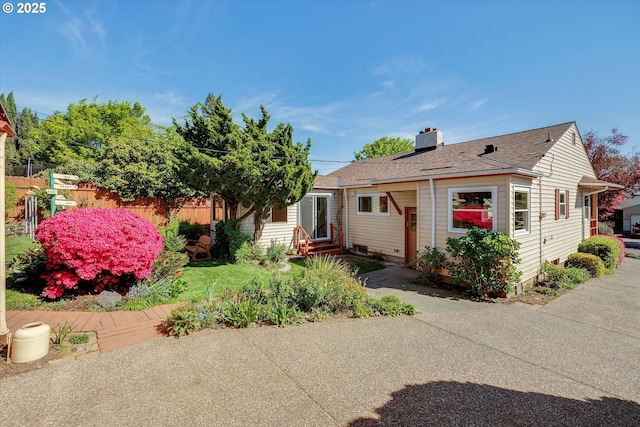 4133 SE Henderson St, Portland, OR 97202 - view of front of home with entry steps, fence, a chimney, and a shingled roof