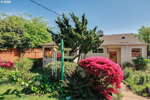 4133 SE Henderson St, Portland, OR 97202 - view of front facade featuring fence and a chimney