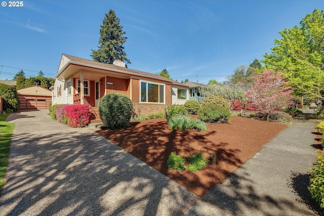 4133 SE Henderson St, Portland, OR 97202 - view of front of home featuring an outbuilding, stone siding, and a chimney