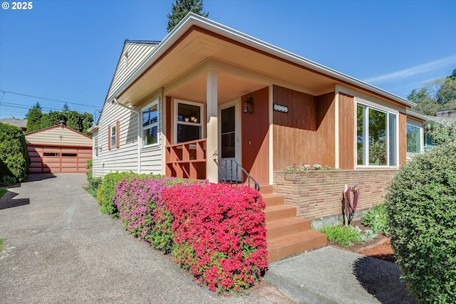 4133 SE Henderson St, Portland, OR 97202 - view of front of house featuring an outbuilding and a detached garage