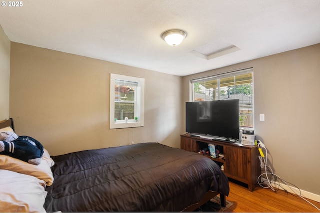 9819 SE Knight St, Portland, OR 97266 - bedroom featuring light wood-type flooring and attic access