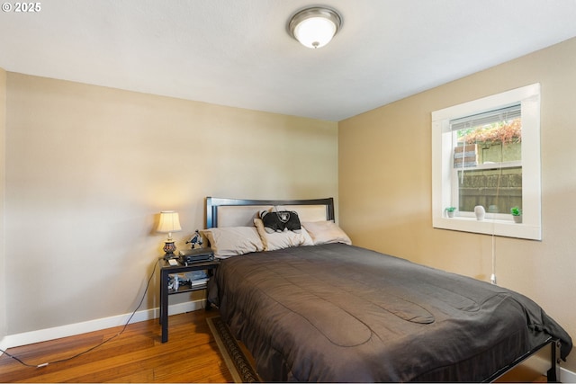 9819 SE Knight St, Portland, OR 97266 - bedroom with hardwood / wood-style flooring and baseboards