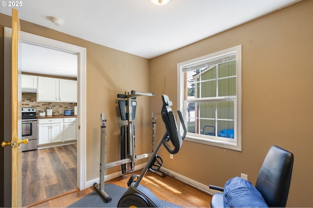 9819 SE Knight St, Portland, OR 97266 - exercise area with wood finished floors and baseboards