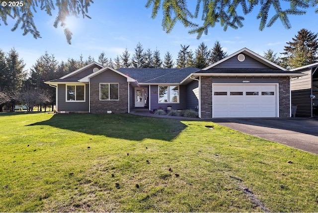 ranch-style home featuring a garage and a front lawn