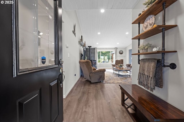 foyer with wood-type flooring and wooden ceiling