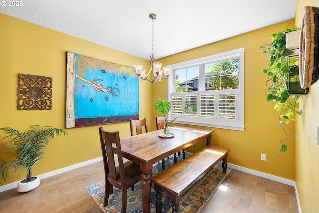 14665 Catalpa Way, Oregon City, OR 97045 - dining space with baseboards, a chandelier, and wood finished floors