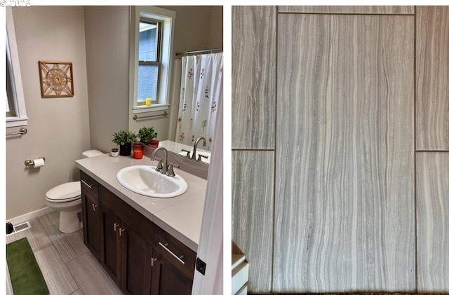 14665 Catalpa Way, Oregon City, OR 97045 - bathroom with toilet, vanity, baseboards, and curtained shower