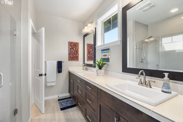 14665 Catalpa Way, Oregon City, OR 97045 - bathroom featuring double vanity, baseboards, and a stall shower