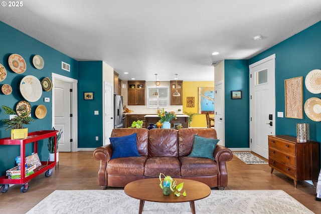 14665 Catalpa Way, Oregon City, OR 97045 - living room featuring baseboards, wood finished floors, and recessed lighting
