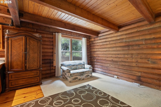 4347 S Schooner Creek Rd, Lincoln City, OR 97367 - sitting room with a wooden ceiling with exposed beams, rustic walls, and wood finished floors