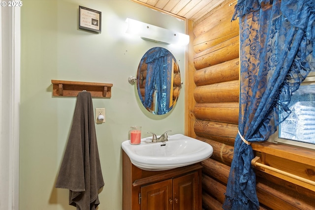 4347 S Schooner Creek Rd, Lincoln City, OR 97367 - bathroom featuring rustic walls and vanity