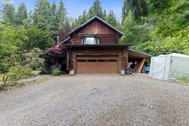 4347 S Schooner Creek Rd, Lincoln City, OR 97367 - log cabin with log siding, driveway, and an outbuilding