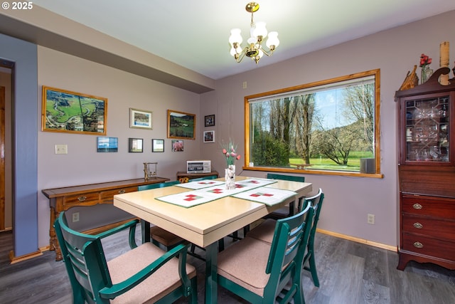 471 Barr Rd, Grays River, WA 98621 - dining room with an inviting chandelier, dark wood-type flooring, and baseboards