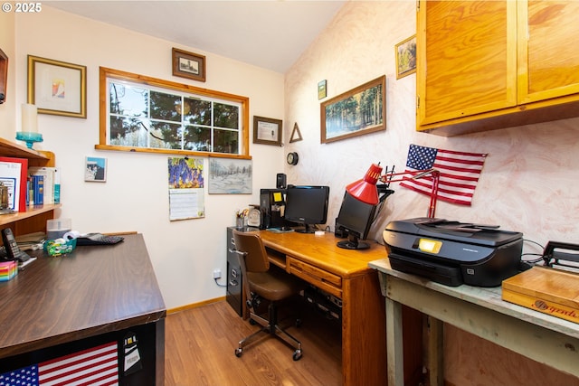 office area with baseboards and wood finished floors