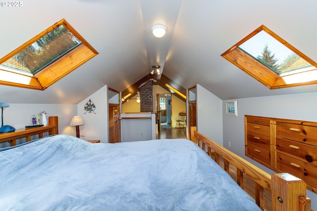 bedroom with lofted ceiling with skylight