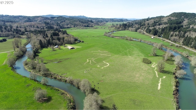 bird's eye view featuring a water and mountain view and a rural view