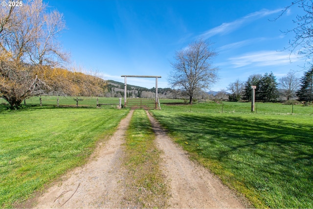 471 Barr Rd, Grays River, WA 98621 - view of yard featuring a rural view, dirt driveway, and fence